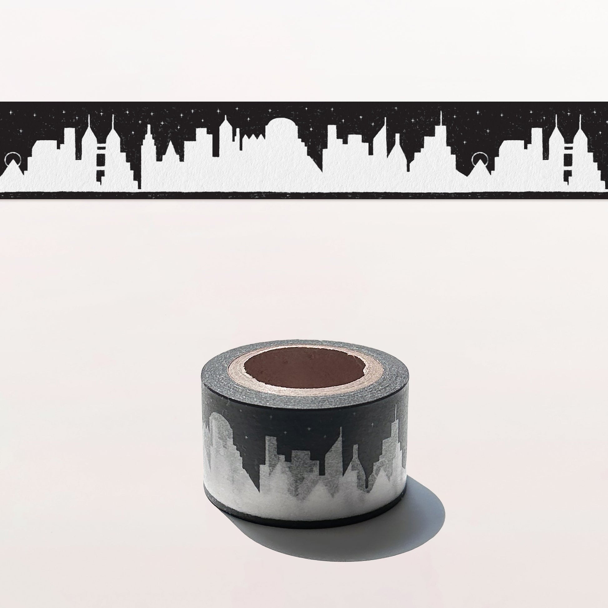 Roll of tape with a cityscape design on a white background