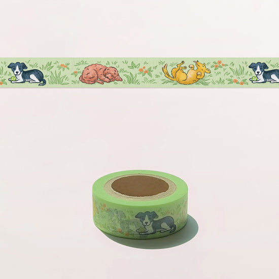 Green masking tape with dog illustrations on a white background