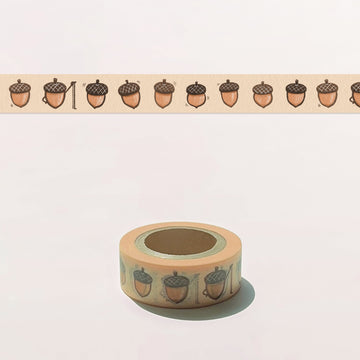 Roll of decorative tape with acorn pattern on a light background
