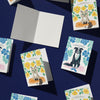 Collection of greeting cards with animal illustrations on a dark blue background
