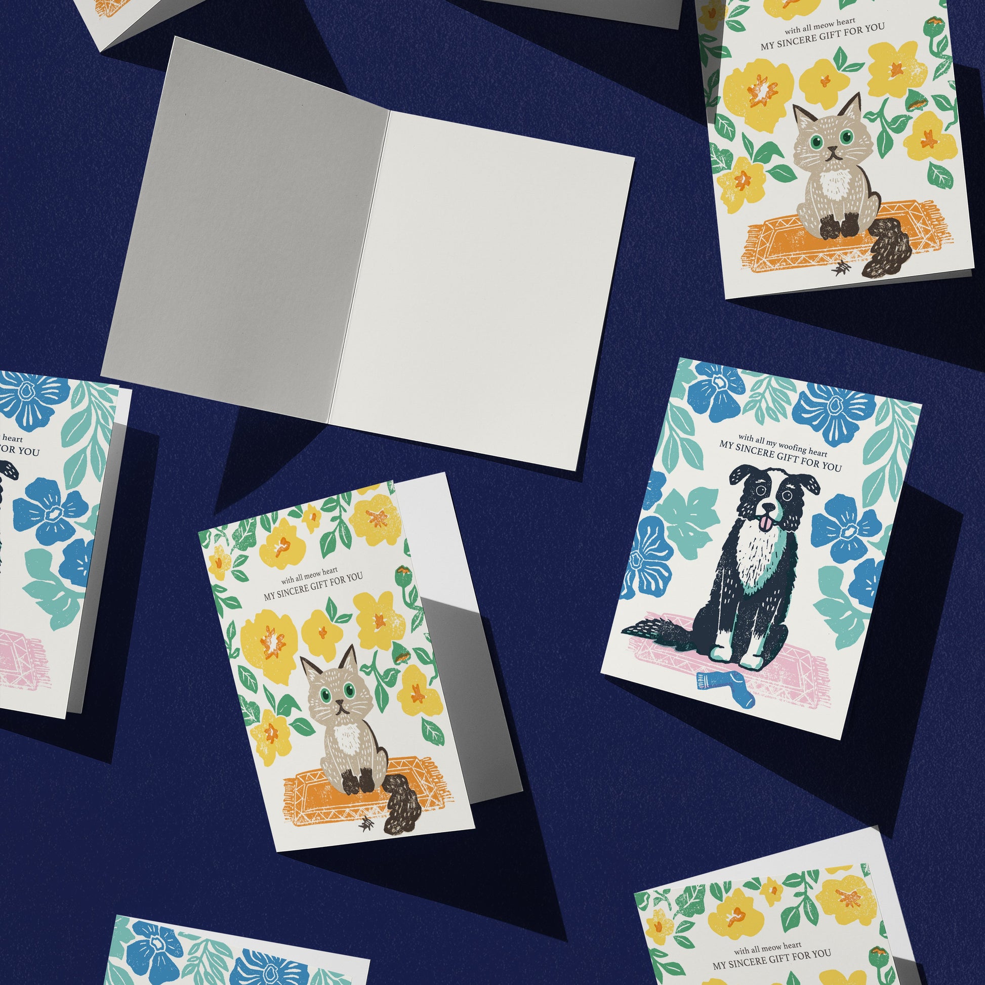 Collection of greeting cards with animal illustrations on a dark blue background