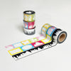 Roll of decorative tape with colorful designs on a white background