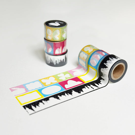 Roll of decorative tape with colorful designs on a white background