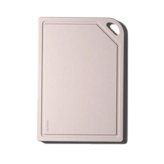 A rectangular cutting board with rounded corners and a small handle cutout in the top right, shown on a plain white background.