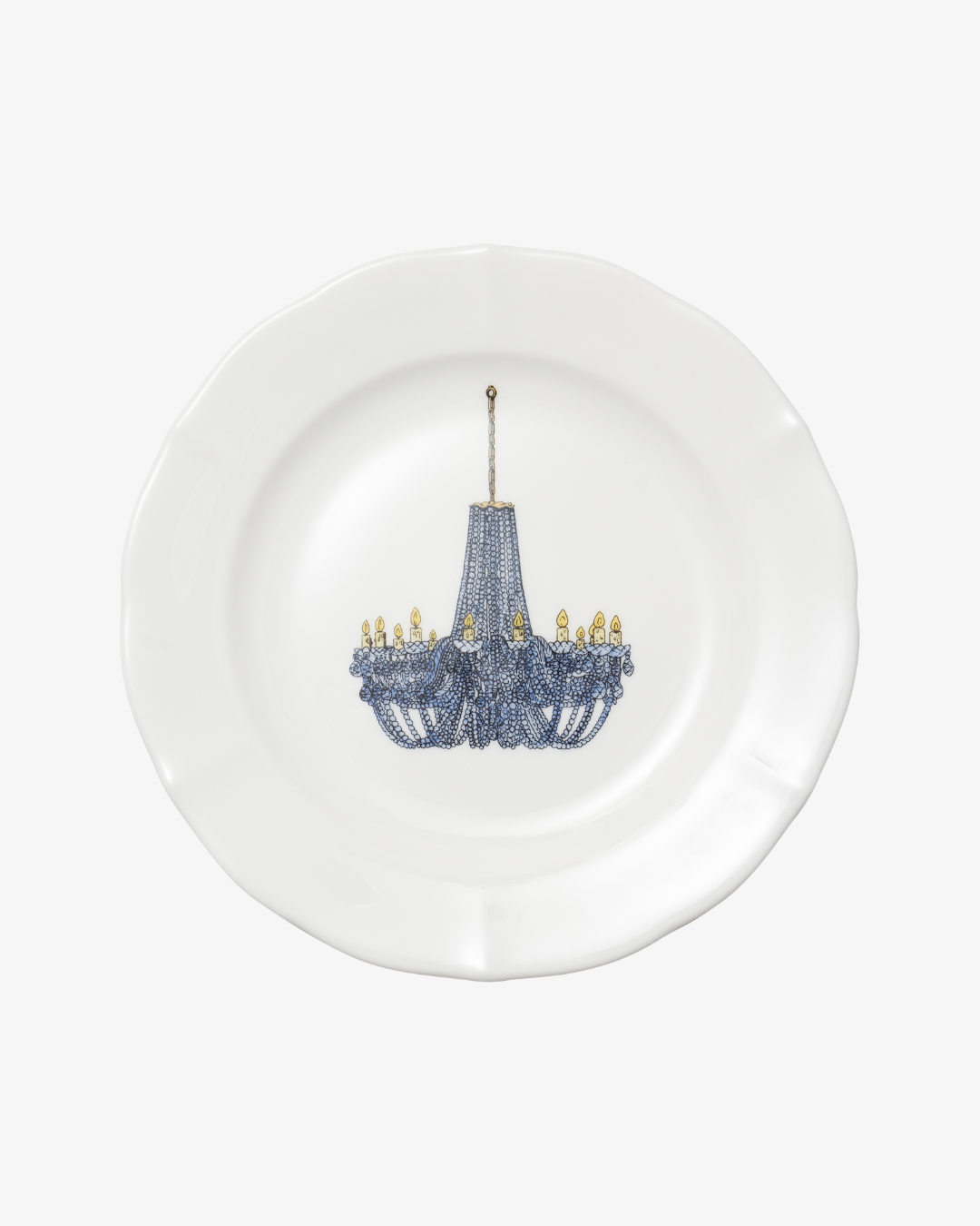 White plate with a decorative blue chandelier design on a white background