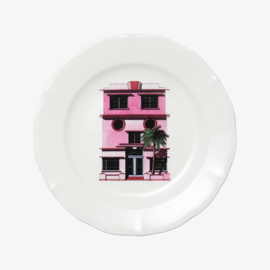 White plate with a pink building illustration on a white background