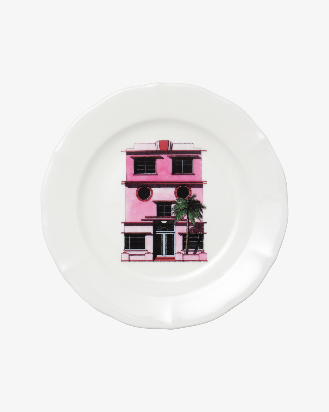 White plate with a pink building illustration on a white background