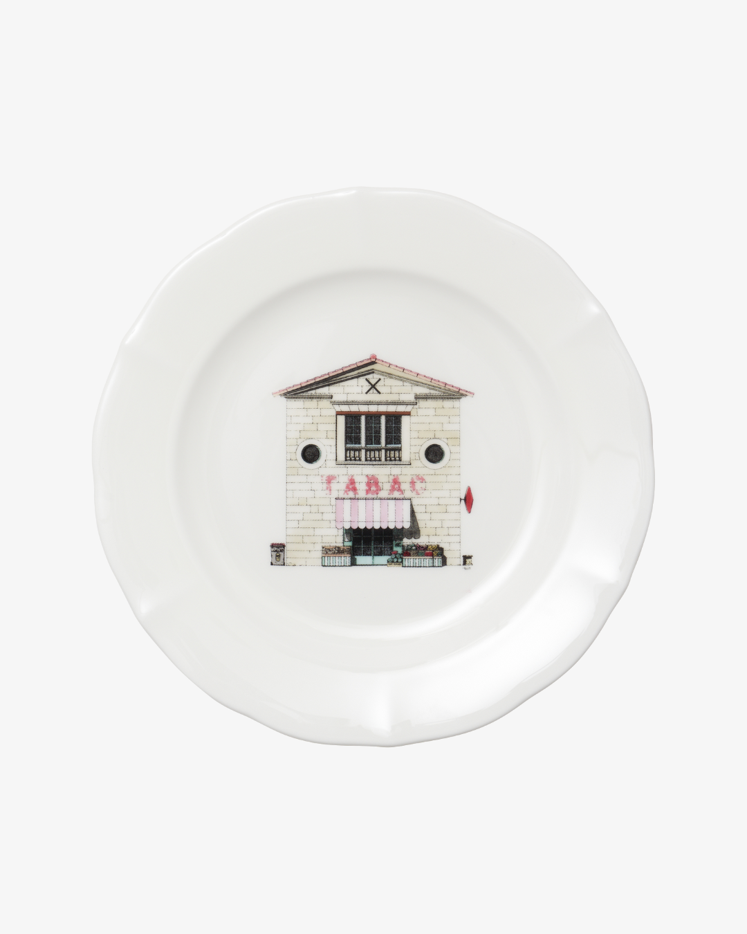 White plate with a printed design of a building on a white background