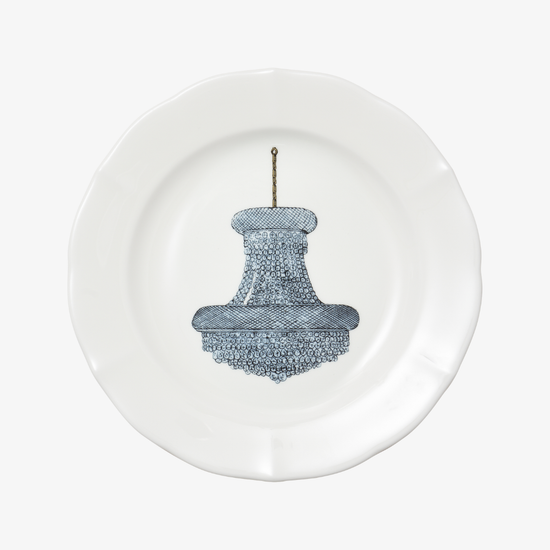 White plate with a blue chandelier design on a white background
