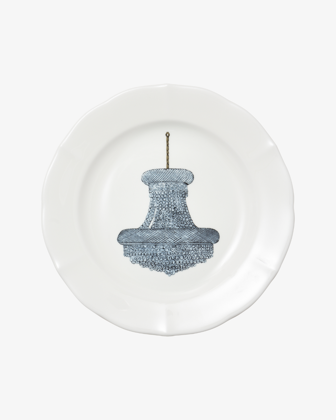 White plate with a blue chandelier design on a white background