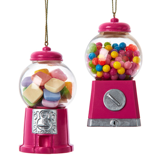 Two pink gumball machines ornaments filled with colorful candies on a white b ackground