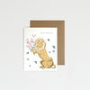 Greeting card with a lion design and floral elements on a white background