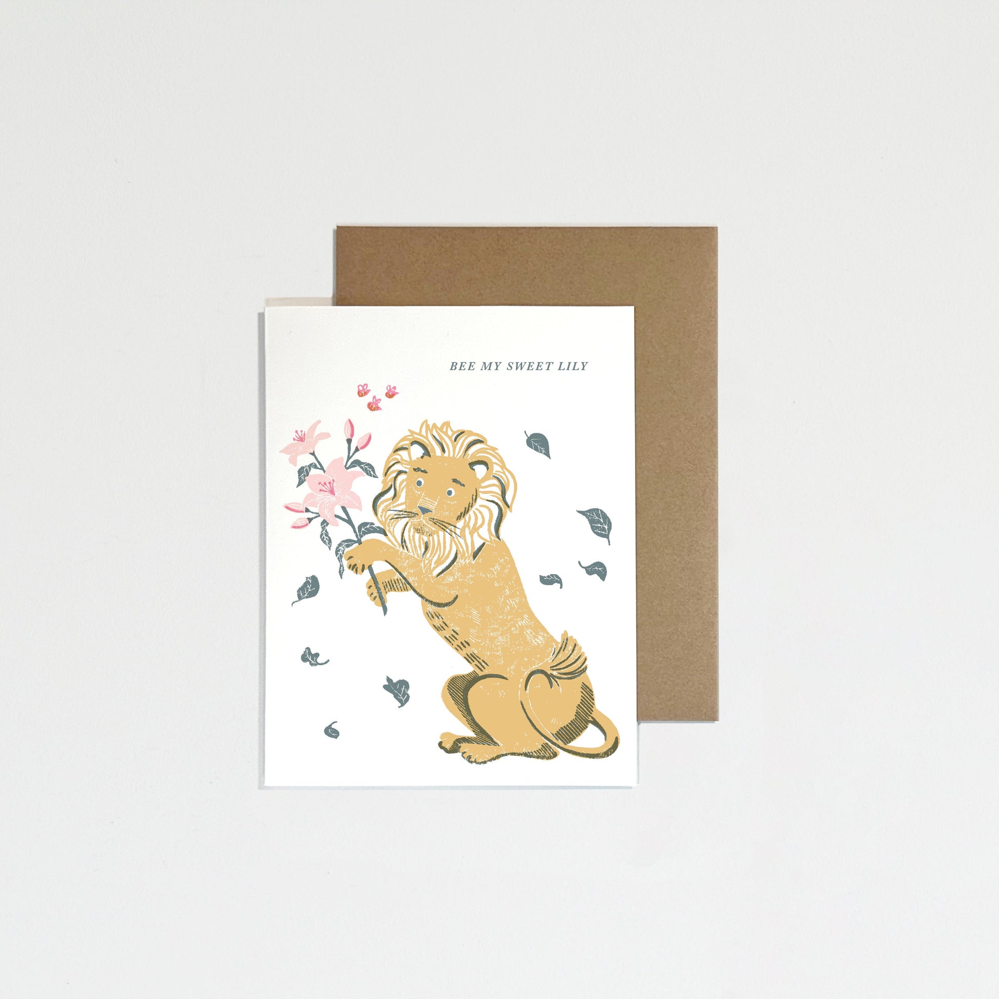 Greeting card with a lion design and floral elements on a white background