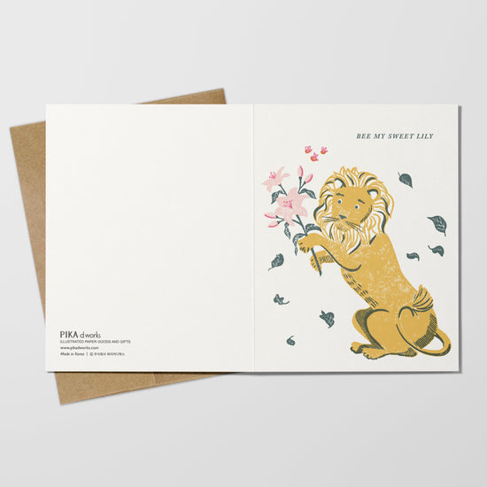 Greeting card with a lion holding flowers on a white background