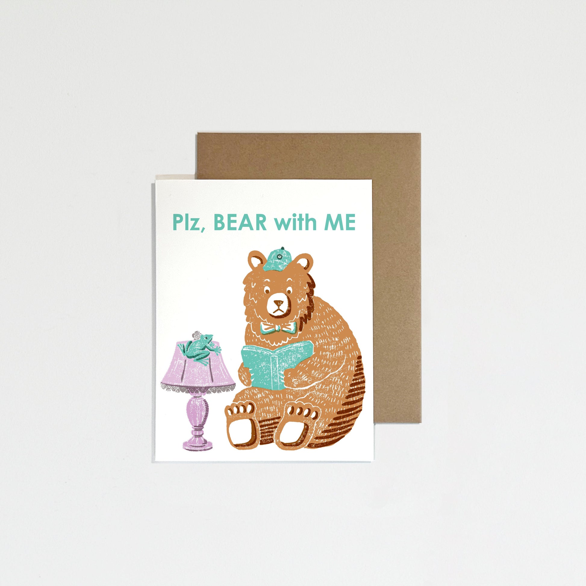 Greeting card with a bear illustration and lamp on a white background.