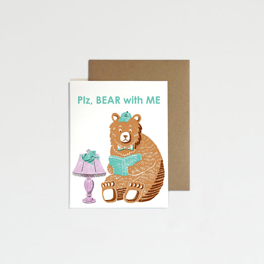 Greeting card with a bear illustration and lamp on a white background.