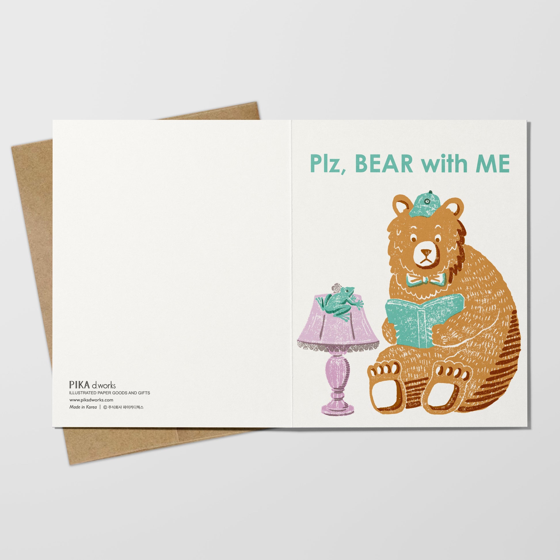 Greeting card with a bear illustration and lamp on a white background.