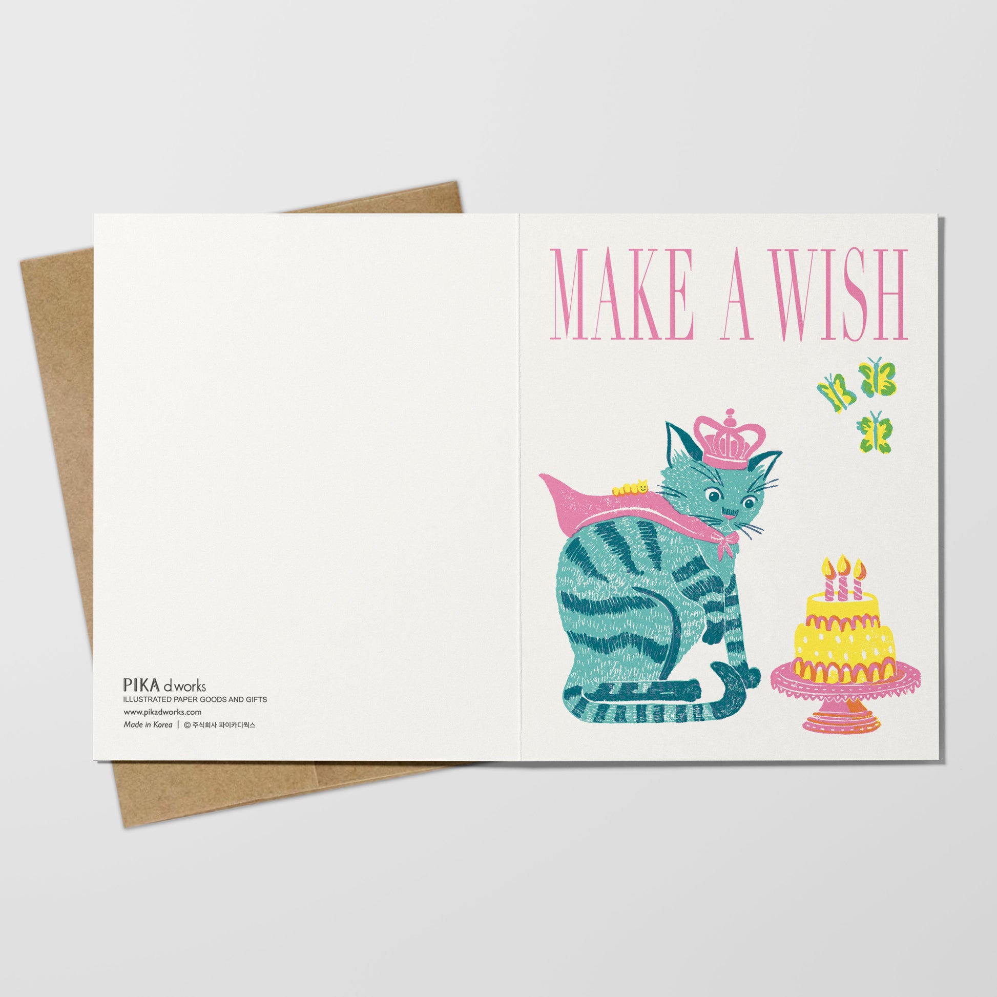 Greeting card with a cat and cake illustration and 'Make a Wish' text on a white background.