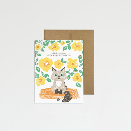 Greeting card with a cat illustration and floral design on a white background