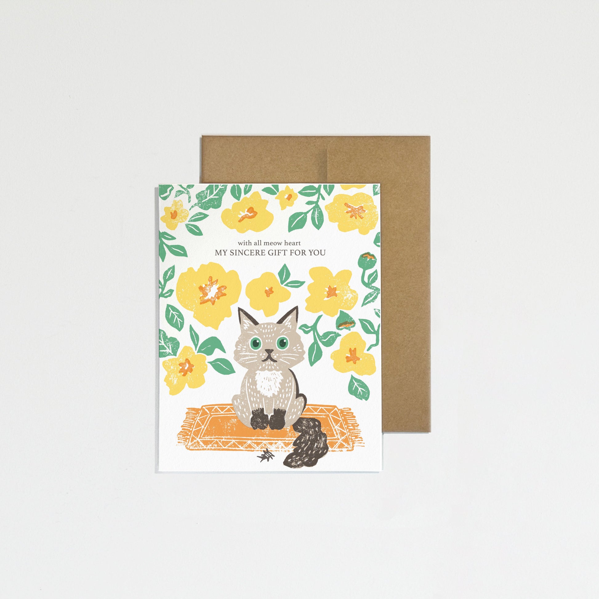 Greeting card with a cat illustration and floral design on a white background