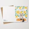 Greeting card with a cat illustration and floral design on a white background