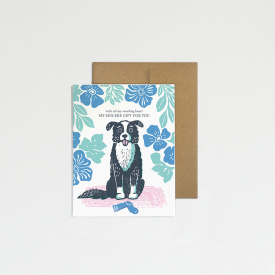 Greeting card with a dog illustration on a floral background