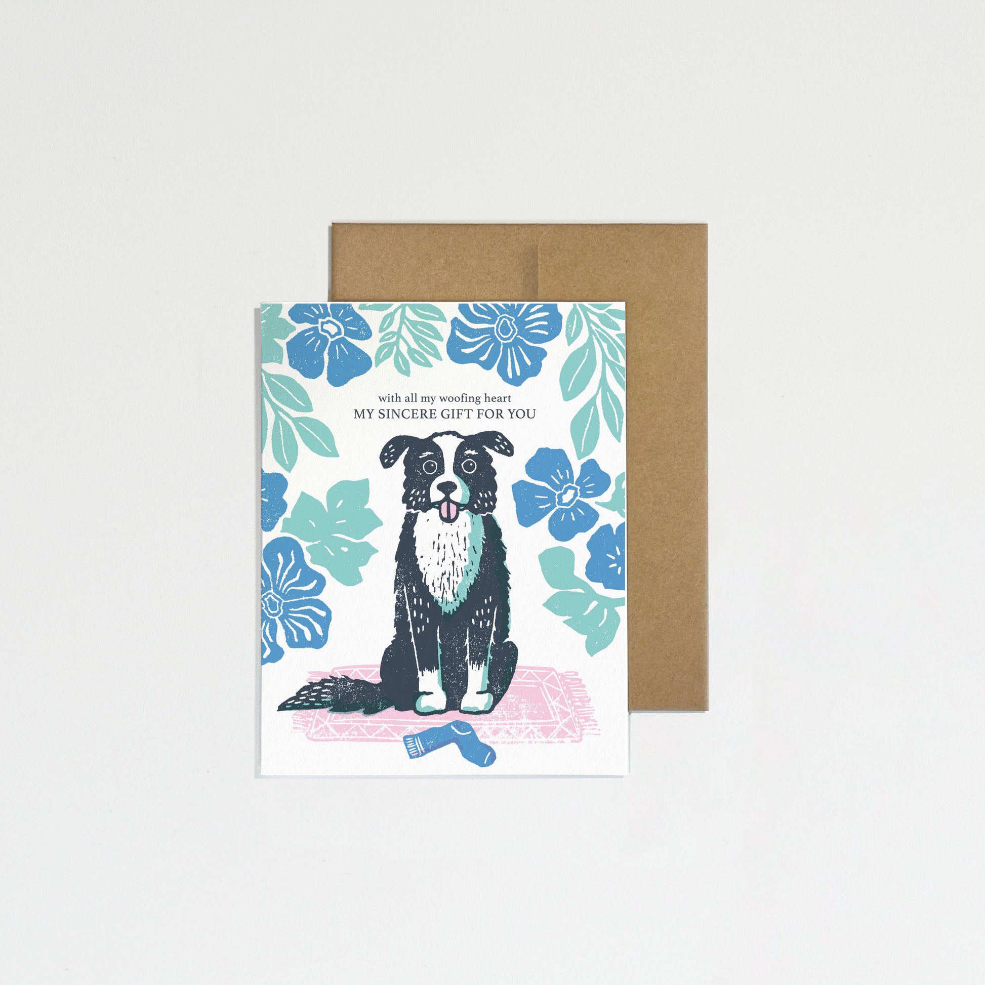 Greeting card with a dog illustration on a floral background