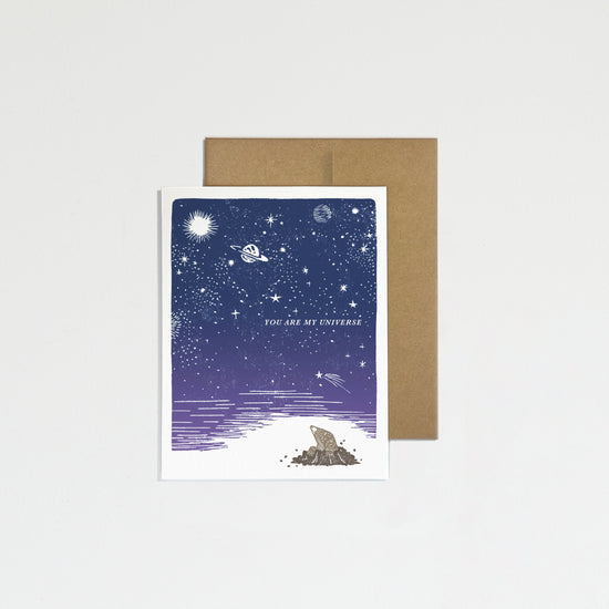 Greeting card with space-themed design on a white background