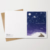 Greeting card with space-themed design on a white background