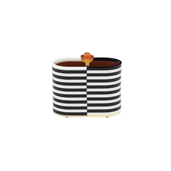 Black and white striped container with a wooden lid on a white background