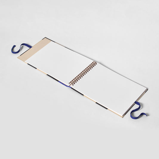 Open notebook with spiral binding on a white background