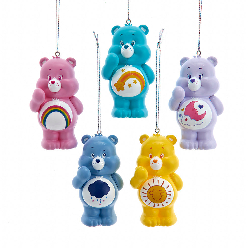 Five colorful Care Bear ornaments on a white background