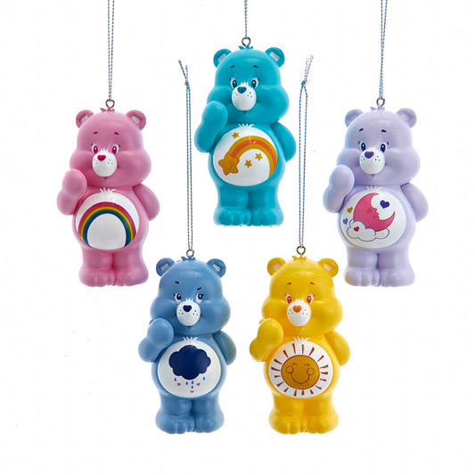 Five colorful Care Bear ornaments on a white background