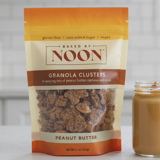 Packaging of Baked by Noon peanut butter granola clusters on a white background