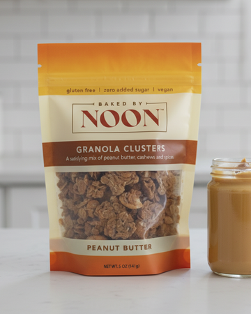 Packaging of Baked by Noon peanut butter granola clusters on a white background
