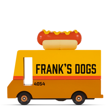 Yellow wooden hot dog truck with the text ‘FRANK’S DOGS’ on the side and a plastic hot dog decoration on the roof.