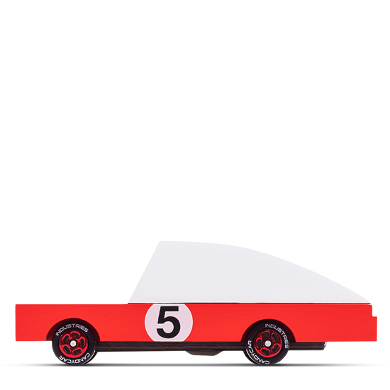 Minimalist red wooden toy race car with a white top and the number 5 printed on the side