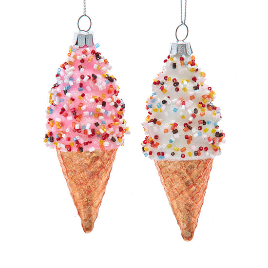 Two ice cream cone ornaments with sprinkles on a white background
