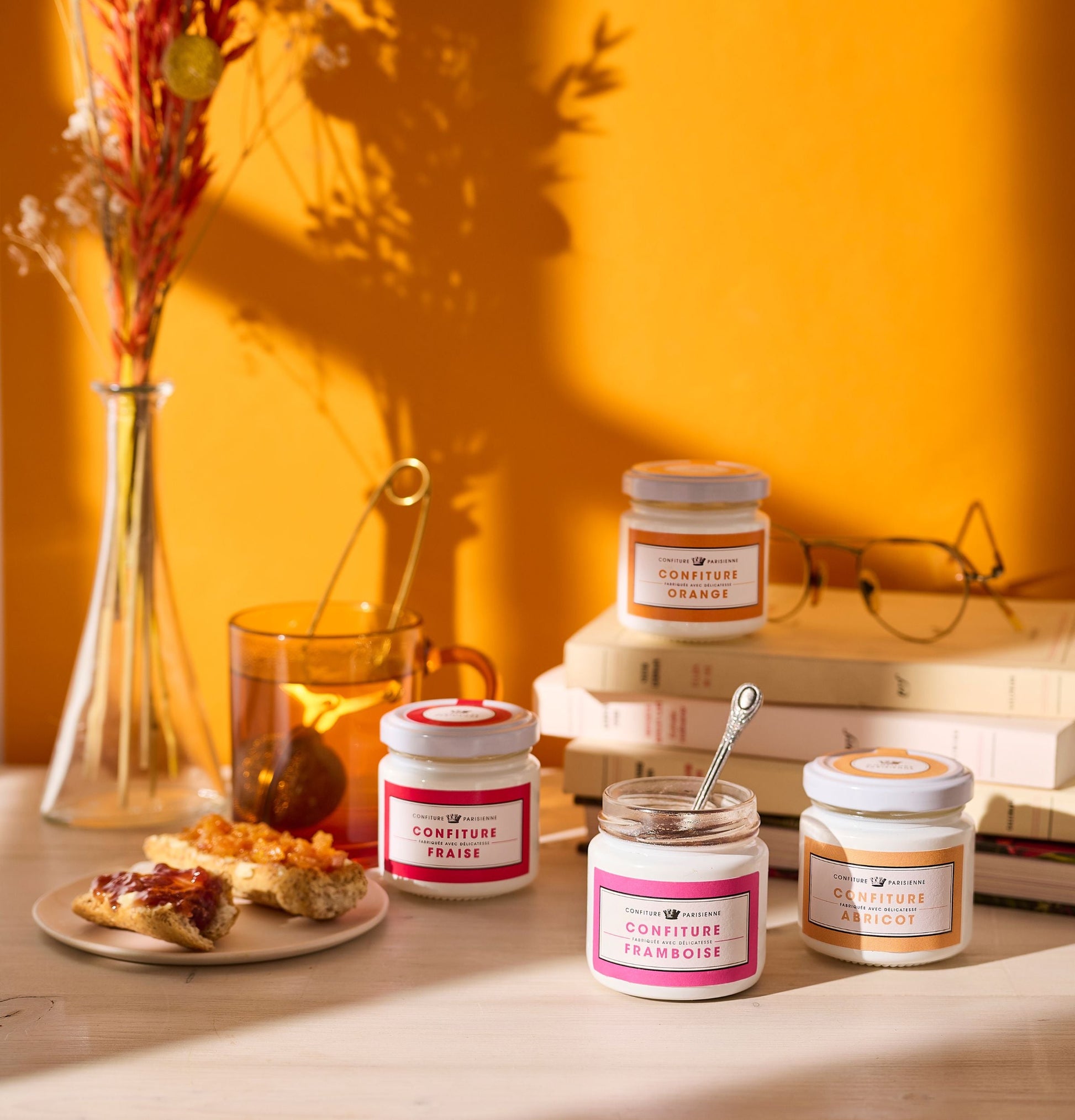 Jars of confiture on a table with a warm background
