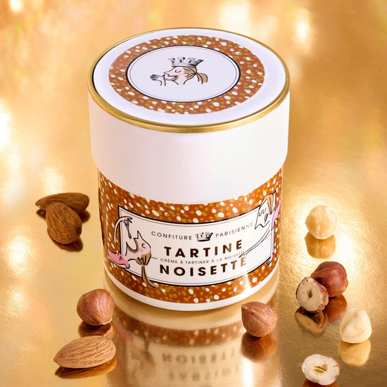 Tartine Noisette jar with almonds on a reflective surface