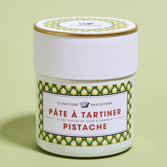 Jar of Pate a Tartiner Pistache on a light green background