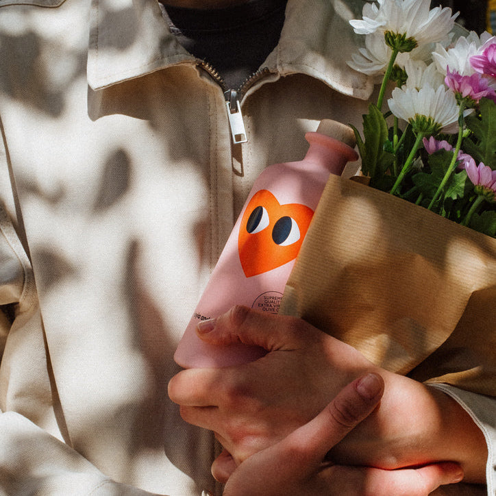 pink extra virgin olive oil bottle lifestyle image