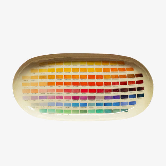 Color swatch tray with a wide range of colors on a white background