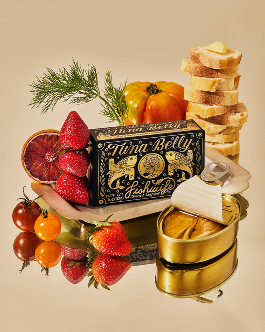 Tuna belly packaging with fruits, bread, and a can on a beige background