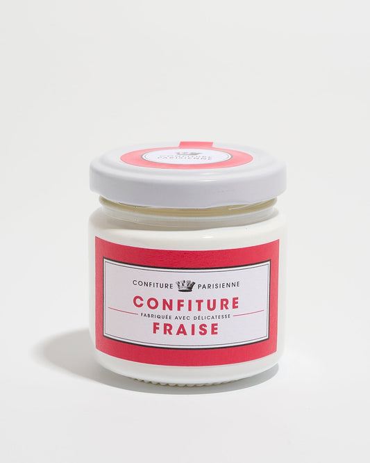 A jar of strawberry jam with a red and white label on a white background