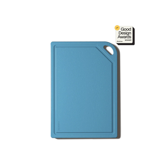 Blue cutting board with Good Design Awards logo on a white background