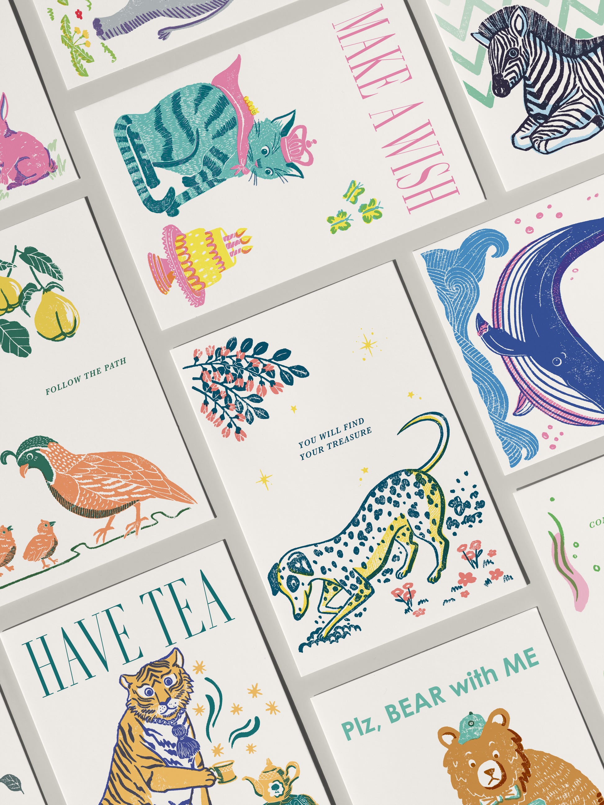 Collection of colorful greeting cards with various illustrations and text.