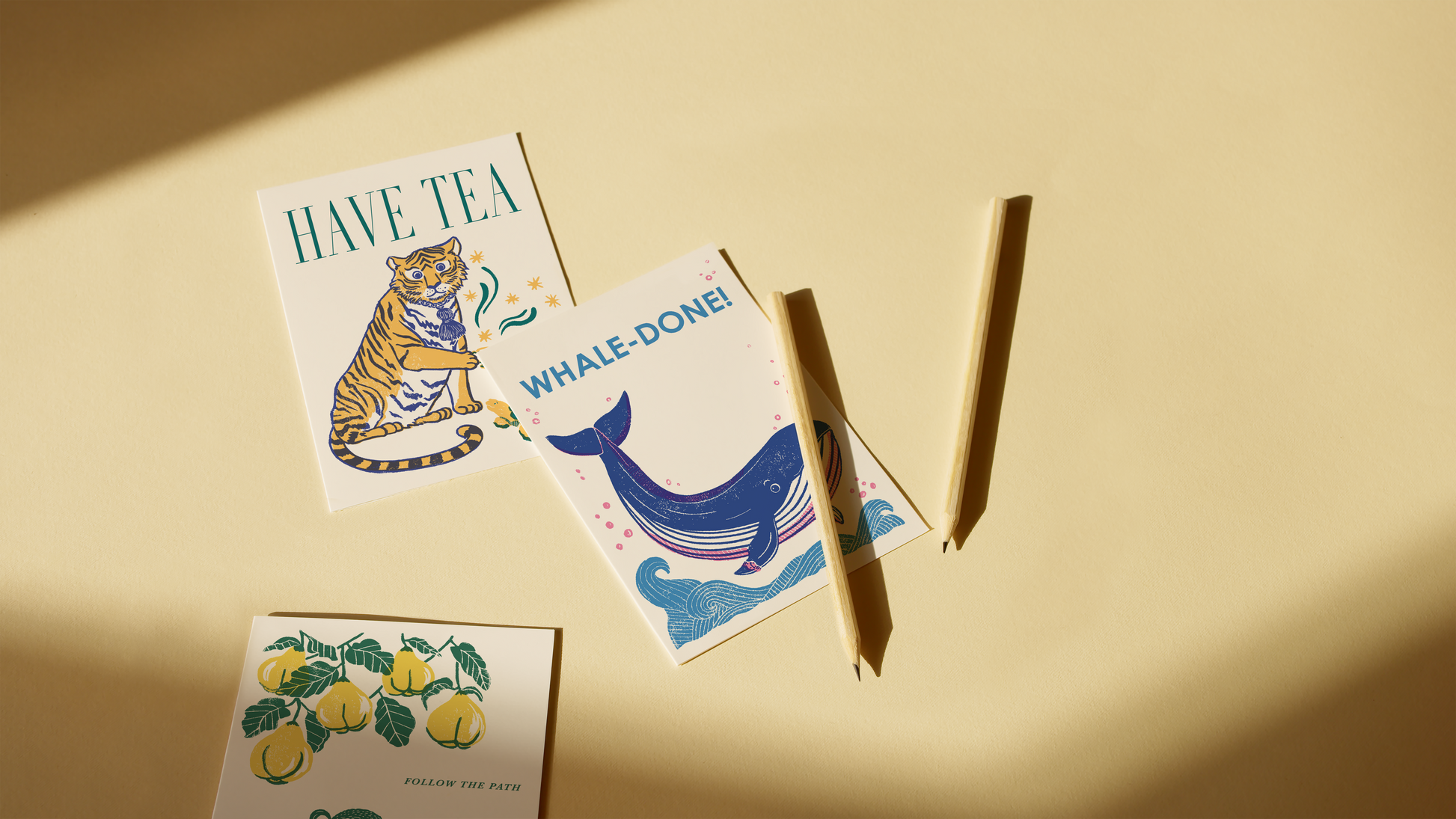 Three illustrated cards with text and graphics on a beige background