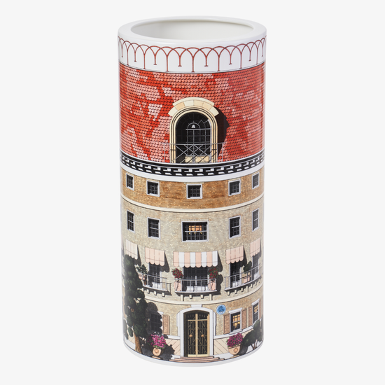 Cylindrical vase with architectural design on a white background