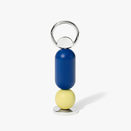 Bottle opener with blue and yellow beads on a white background